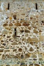 old stone wall of ancient monastery as abstract background Royalty Free Stock Photo