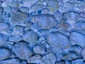 An old stone wall. Background of blue stones. Stone texture. Blue stones. Royalty Free Stock Photo