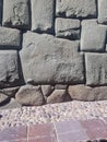 Old stone wall and cobblestone path in Cuzco Royalty Free Stock Photo