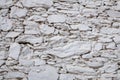 Old stone wall consisting of white stacked stones, background, pattern, texture, wallpaper