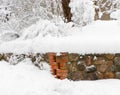 Old stone wall covered with snow Royalty Free Stock Photo