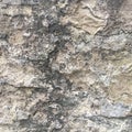 Old stone wall with cracks. Textural abstract background. Royalty Free Stock Photo