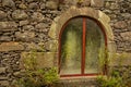 Old stone wall house, with window, arched, Azores islands Royalty Free Stock Photo