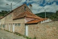 Old stone wall house with wooden door Royalty Free Stock Photo