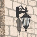 Old stone wall with a lantern. Royalty Free Stock Photo
