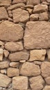 Old stone wall made without cement between the stones Royalty Free Stock Photo