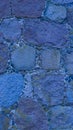 An old stone wall. Masonry. Background of blue stones. The texture of the stone. Vertical image. Royalty Free Stock Photo