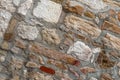 Old stone wall rectangular square cobblestones beige brown in cement-base background urban Royalty Free Stock Photo