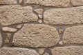 Old stone wall. Rock wall texture. Sand color. Royalty Free Stock Photo