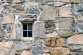 Old stone wall and small window Royalty Free Stock Photo