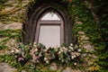 Old stone wall with a wedding decorated window Royalty Free Stock Photo