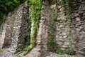 Old stone walls fortress with green ivy.Real texture of old stone bricks. Quality photo background of brickwork. Good for 3D works Royalty Free Stock Photo