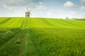 An old stone windmill in field