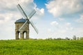 An old stone windmill in field