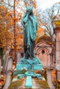 Old stone woman monument in the most famous cemetery of Paris Pere Lachaise, France. Tombs of various famous people Royalty Free Stock Photo