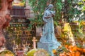 Old stone woman monument in the most famous cemetery of Paris Pere Lachaise, France. Tombs of various famous people Royalty Free Stock Photo