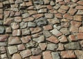 An old stoneblock pavement cobbled with natural stone blocks with gaps between blocks Royalty Free Stock Photo