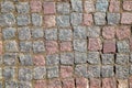 An old stoneblock pavement cobbled with rectangular granite blocks as a background Royalty Free Stock Photo