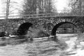 Old stonebridge over the cold water in sweden Royalty Free Stock Photo