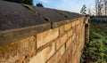 Old stonework boundary wall seen at an old church yard. Royalty Free Stock Photo