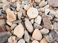 Old stony pavement from natural gravel, dry rounded and colorful pebbles.