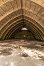 Old storage room. Abandoned hangar. Vertical frame Royalty Free Stock Photo