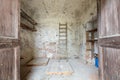 Old storage room with wooden portal in old country house Royalty Free Stock Photo