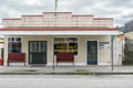 Old store and fish and chip shop closed from main street in small town