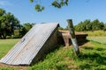 An Old Storm Cellar or Tornado Shelter in Rural Oklahoma.