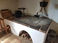 Old stove with pots and wood and bricks