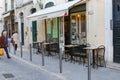 Old street breakfast terrace people, Alfama, Lisbon Royalty Free Stock Photo