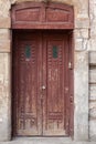 Old street brown vintage wooden doors with a glass