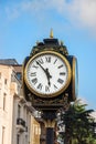 Old Street Clock In Europe. Clock Face With Roman Numerals And Arrows, Cast-iron Column And Gold Decorative Elements Royalty Free Stock Photo