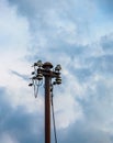 Old street concrete pillar with rusty iron part at top and cut wires. Installation or dismantling of electricity. Broken energy Royalty Free Stock Photo