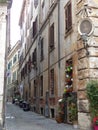 Old street with in the corner a frame with a painting of the Virgin Mary to Rome in Italy.