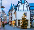 Old street decorated for Christmas in the historic center of Bernkastel-Kues, Rhineland-Palatinate, Germany. Toned image Royalty Free Stock Photo