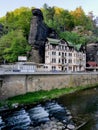 Old street in Hrensko village with mountains behind and river Kamenice. Hrensko, Czech republic