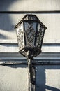 Old street iron lamp. Wall Street Lamp. Beautiful Forged Lantern Royalty Free Stock Photo