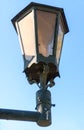 Old street lamp on blue sky background Royalty Free Stock Photo