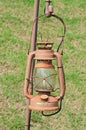 Old street lamp isolated hanging on rust steel