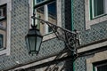 Old street lamp and lisbon traditional tiles facade