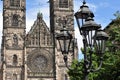 Old street lamp and Lorenz church in Nuremberg Royalty Free Stock Photo