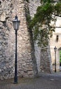 Old street lamp near castle walls Royalty Free Stock Photo
