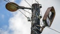 old street lamp on a pillar against a blue cloudy sky Royalty Free Stock Photo