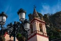 Old street lamp and Santa Maria de la Mesa church