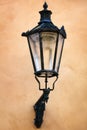 Old street lamp on yellow wall Royalty Free Stock Photo