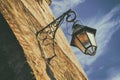 Old street lantern on a stone wall Royalty Free Stock Photo