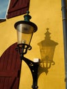 Old street light lamp lantern on a yellow wall in Denmark Royalty Free Stock Photo