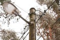 Old street light lamp pole with old lamp and electric wiring Royalty Free Stock Photo