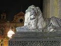 Old street light and lion sculpture on the 19th century leeds city hall building at night with old city building in the background Royalty Free Stock Photo